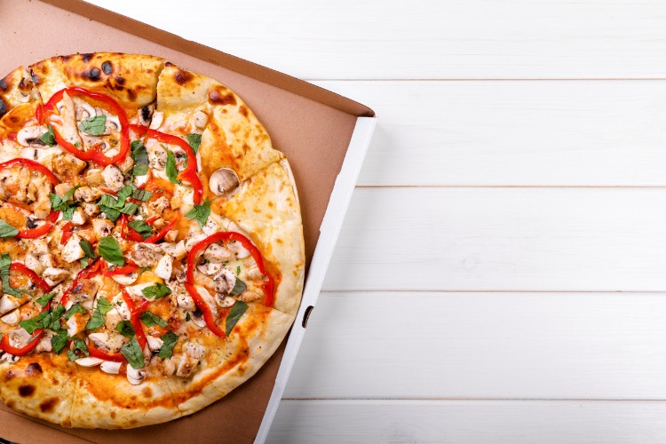 Je bekijkt nu Waarom pizza een hele slechte overwerkmaaltijd is